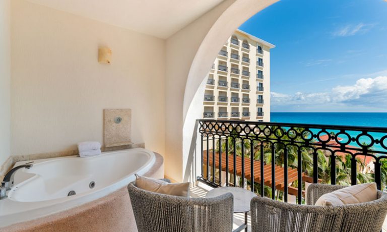 Balcony in the Deluxe Ocean View Room with jacuzzi, providing panoramic ocean views and a serene retreat for guests.