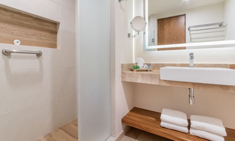 Sleek and contemporary bathroom setup in the Deluxe Lagoon View Room, offering a serene retreat for guests.