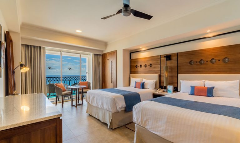 Two inviting beds with crisp linens and stunning ocean views.