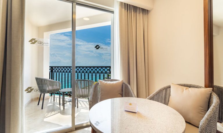 Panoramic vistas of the sea from the Deluxe Ocean View Room's balcony, ideal for relaxation.