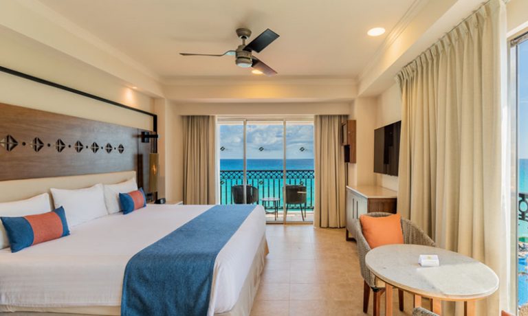 Cozy beds with plush bedding overlooking the serene ocean.