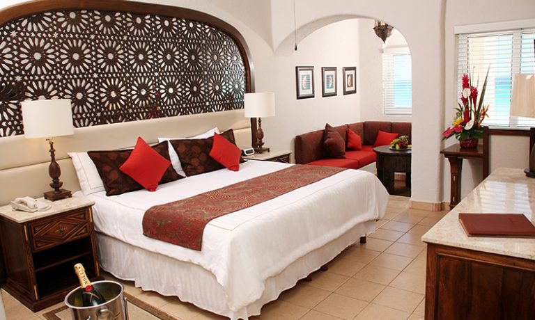 Deluxe Lagoon View Room with one king-size bed, featuring panoramic views of the tranquil lagoon for a relaxing stay.