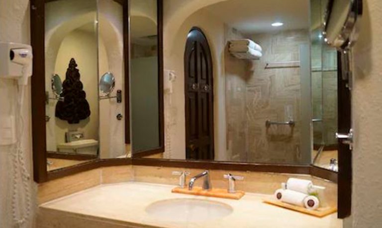 Bathroom in the rooms featuring modern fixtures, elegant design, and luxurious amenities for guests' comfort.